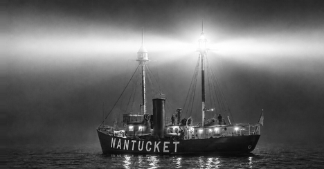 Nantucket Lightship / LV-112 at anchor at night, lantern lit